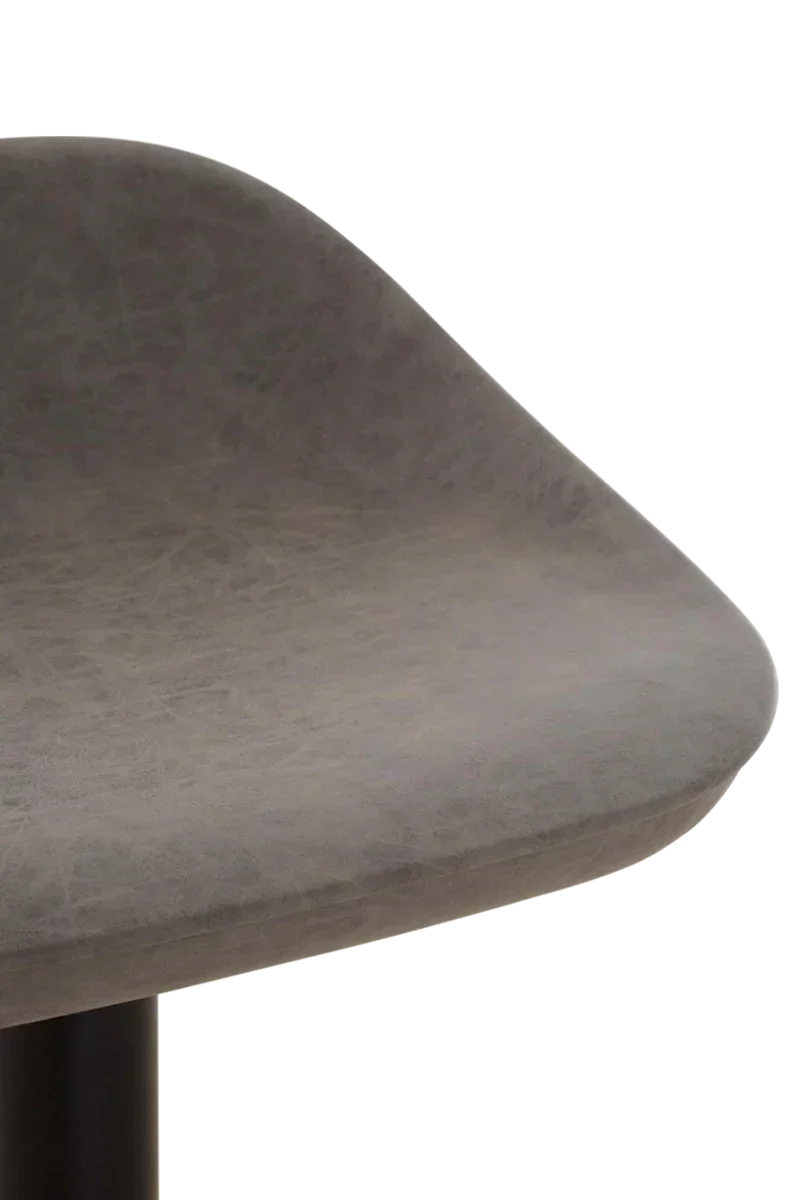 Close-up of grey faux leather dining chair seat with curved edge