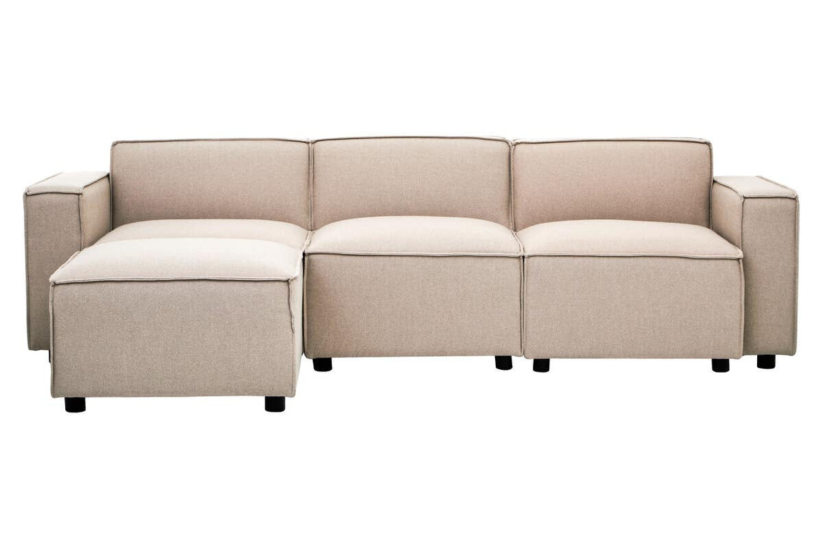 A modular sofa with a natural fabric upholstery, featuring an armless design and three connected sections. The sofa has a light beige color and rests on small black wheels for easy mobility. The cushions are plush and the overall structure is modern and minimalist