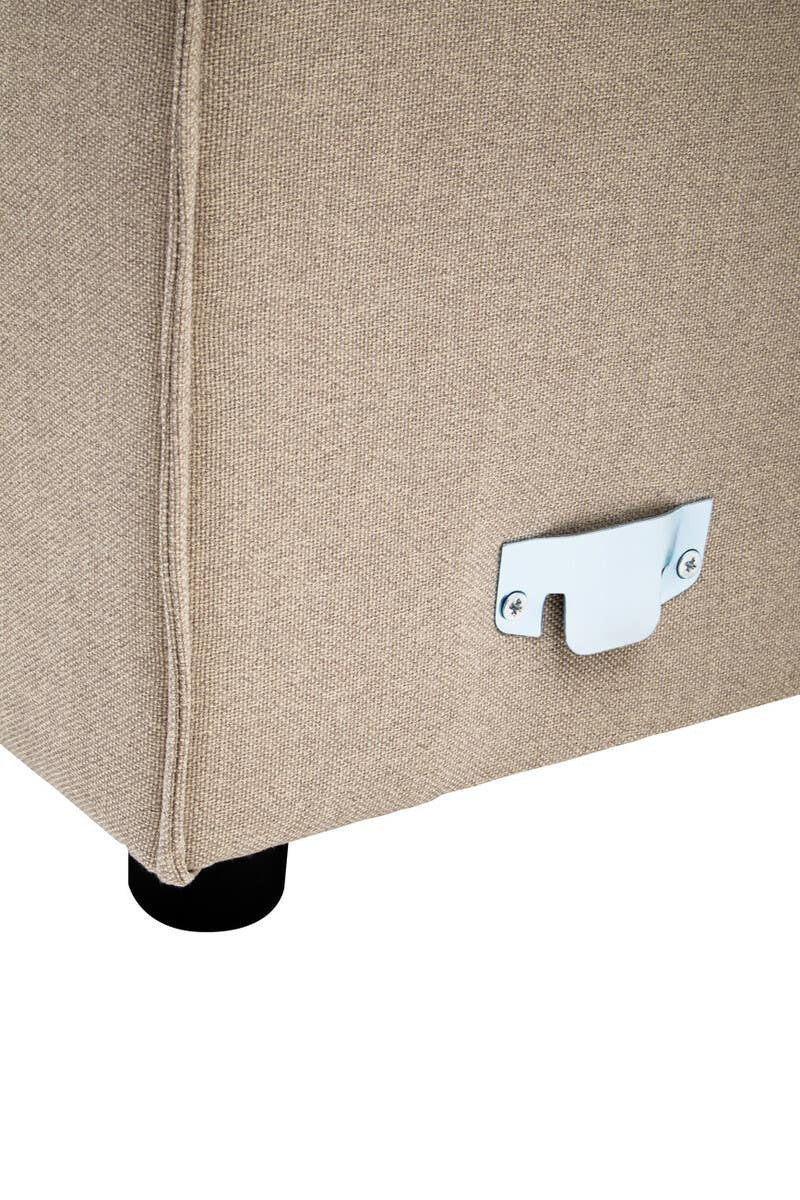 Natural fabric in a light beige color covers the side of a modular sofa, showcasing a sleek design with no armrests. The bottom features a small metallic connector and black plastic feet for stability