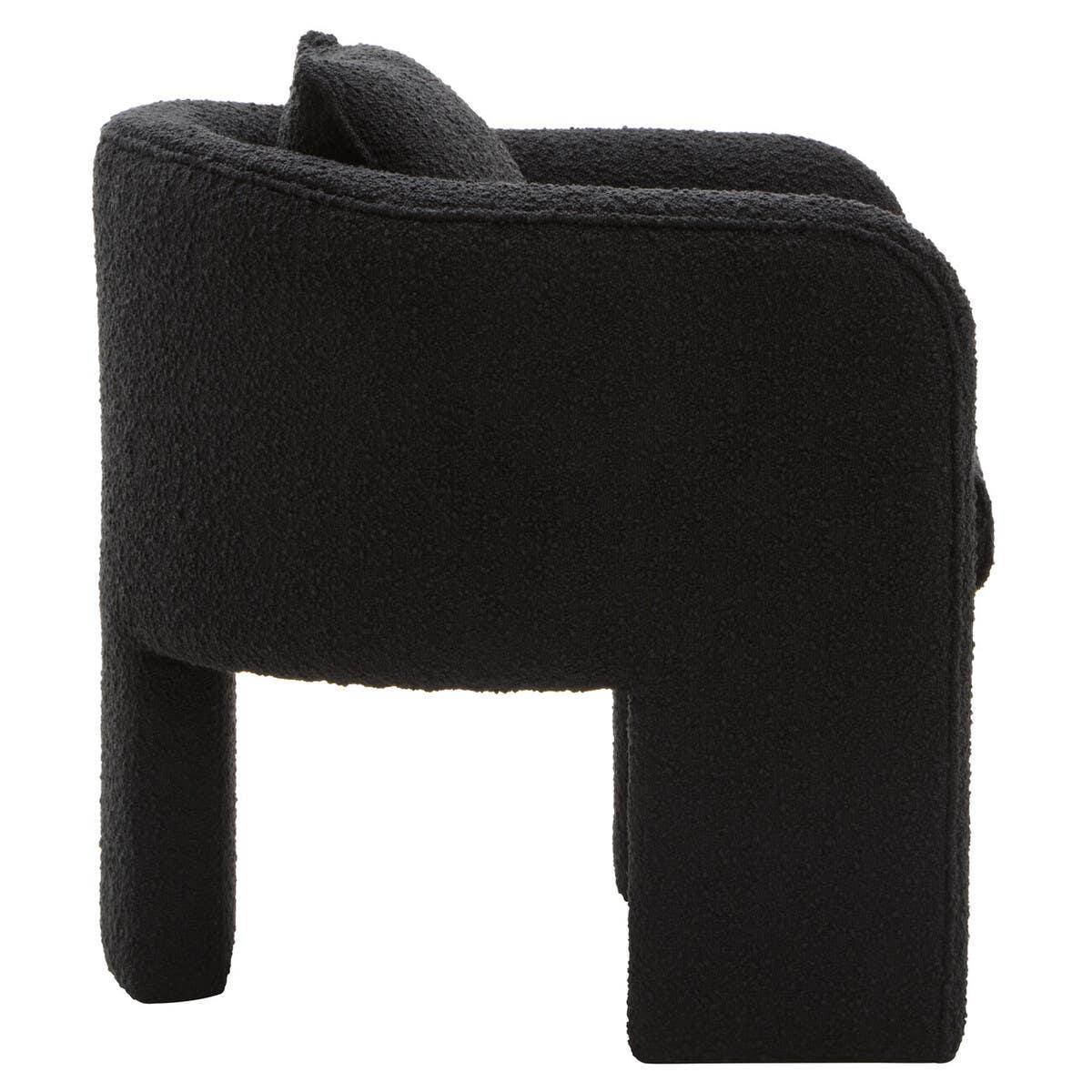 Side view of black boucle accent chair with thick cushioned seat and modern design