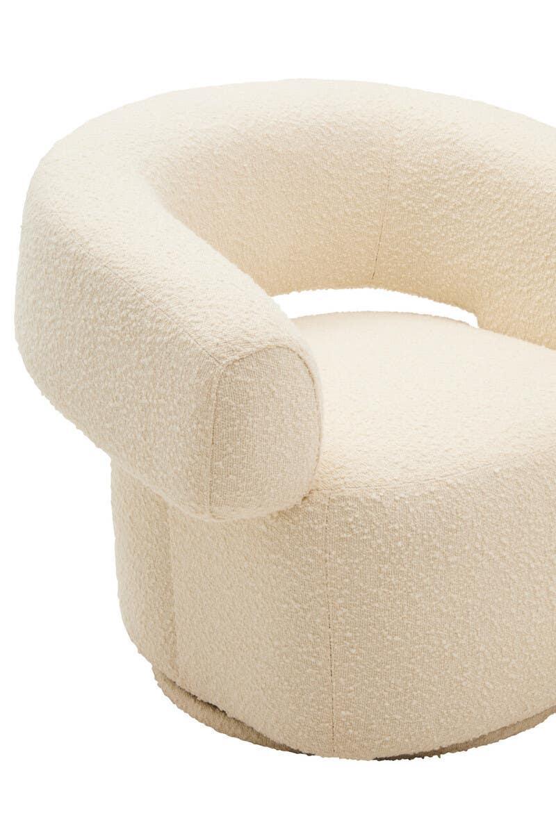 Cream boucle accent chair with curved backrest and modern round base