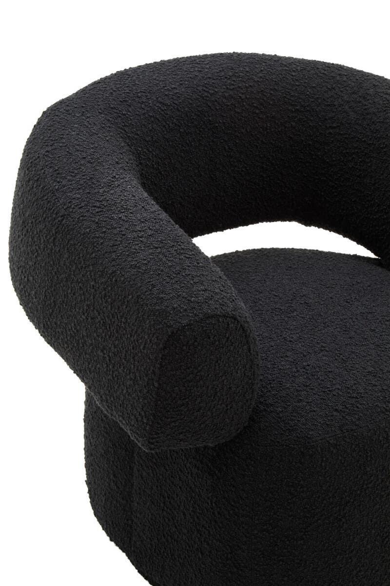 Curved black boucle accent chair with textured fabric close-up on armrest and seat