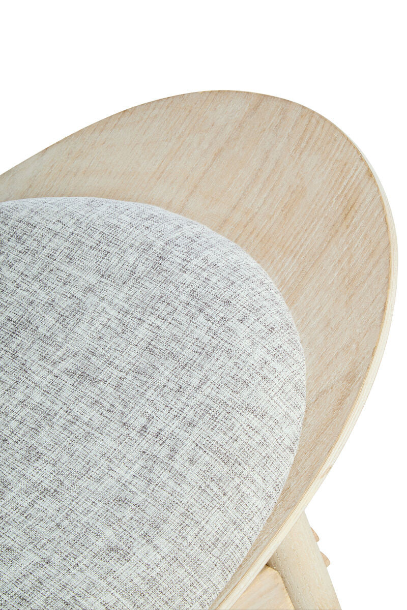 Grey fabric upholstery with a textured finish covers the rounded seat of the chair, complemented by a light washed elm wood backrest and frame.