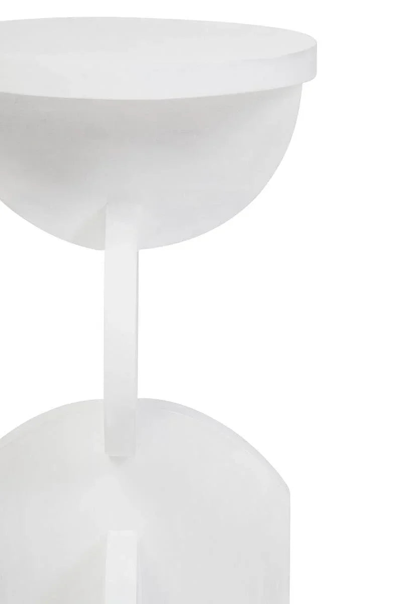 White round side table with sculptural base in close-up view