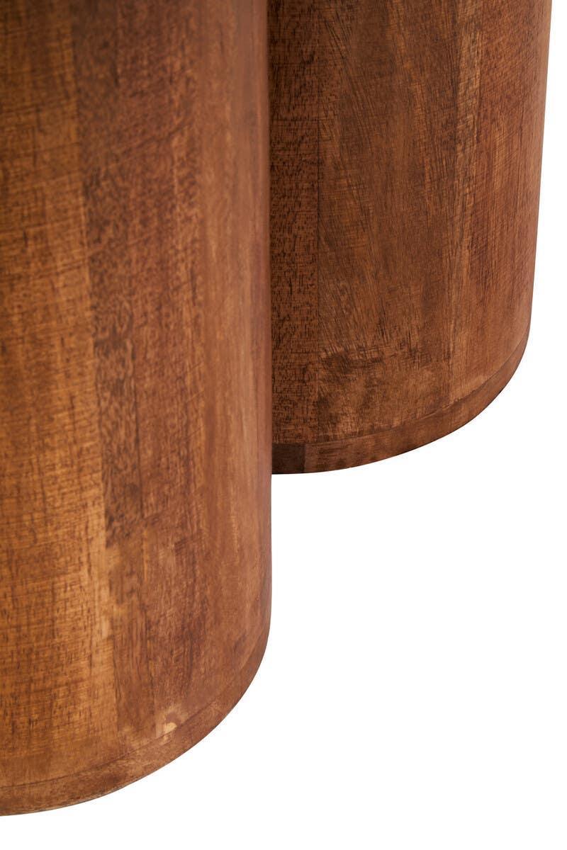 Close view of round wooden table legs with natural wood grain finish