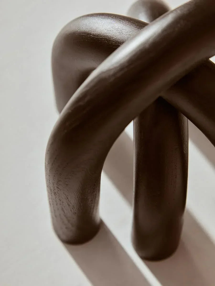 Dark brown wooden knot sculpture with smooth finish, tabletop decorative accent