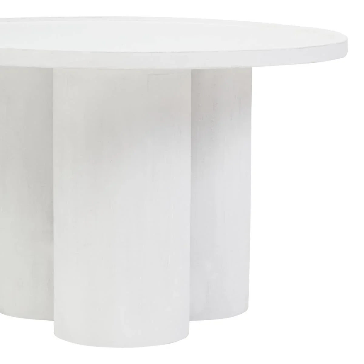 Round white dining table with thick cylindrical legs and smooth matte finish