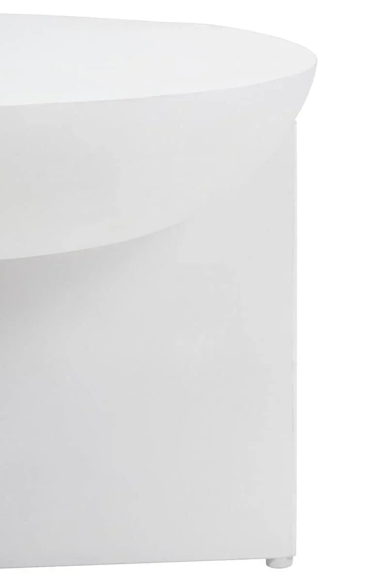 Closeup of white modern coffee table with curved edge and minimalist design