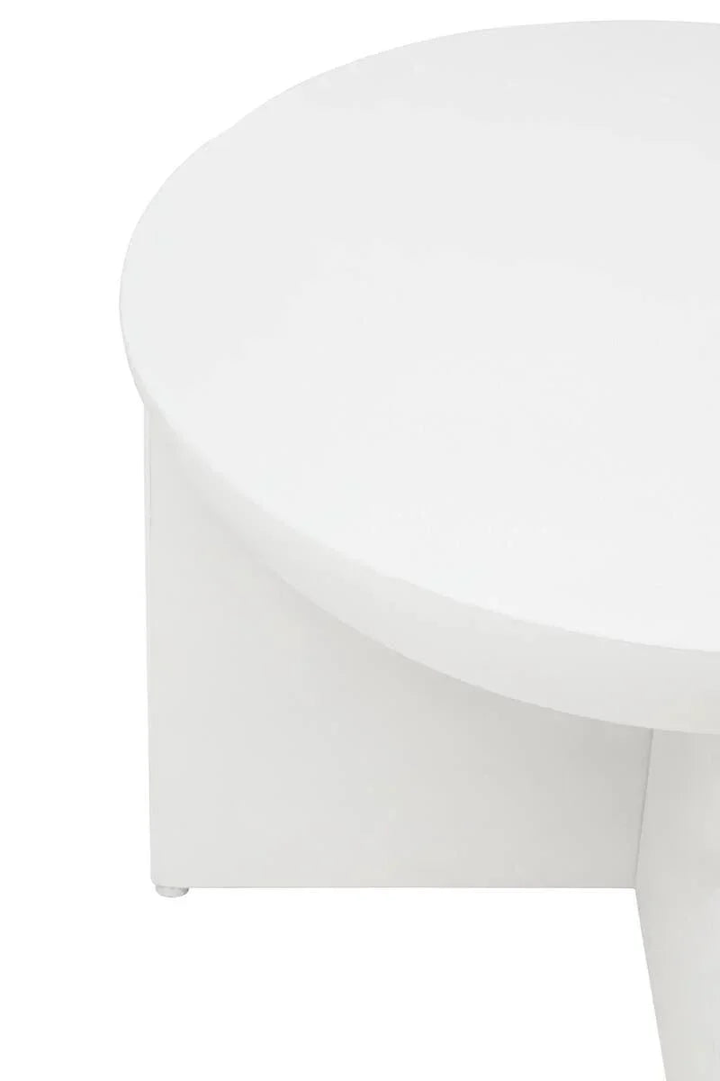 Close up of round white coffee table with smooth finish and modern base