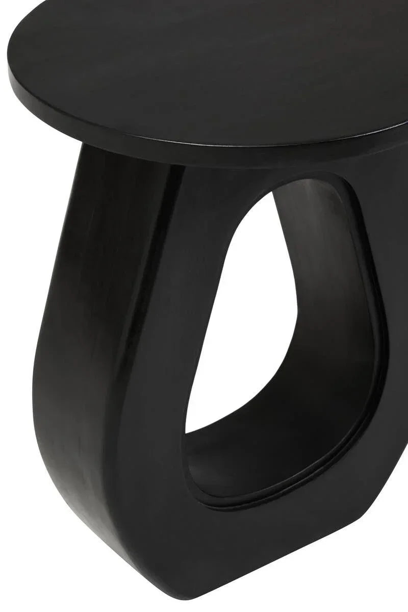 Black modern side table with oval base and smooth matte finish, close-up view