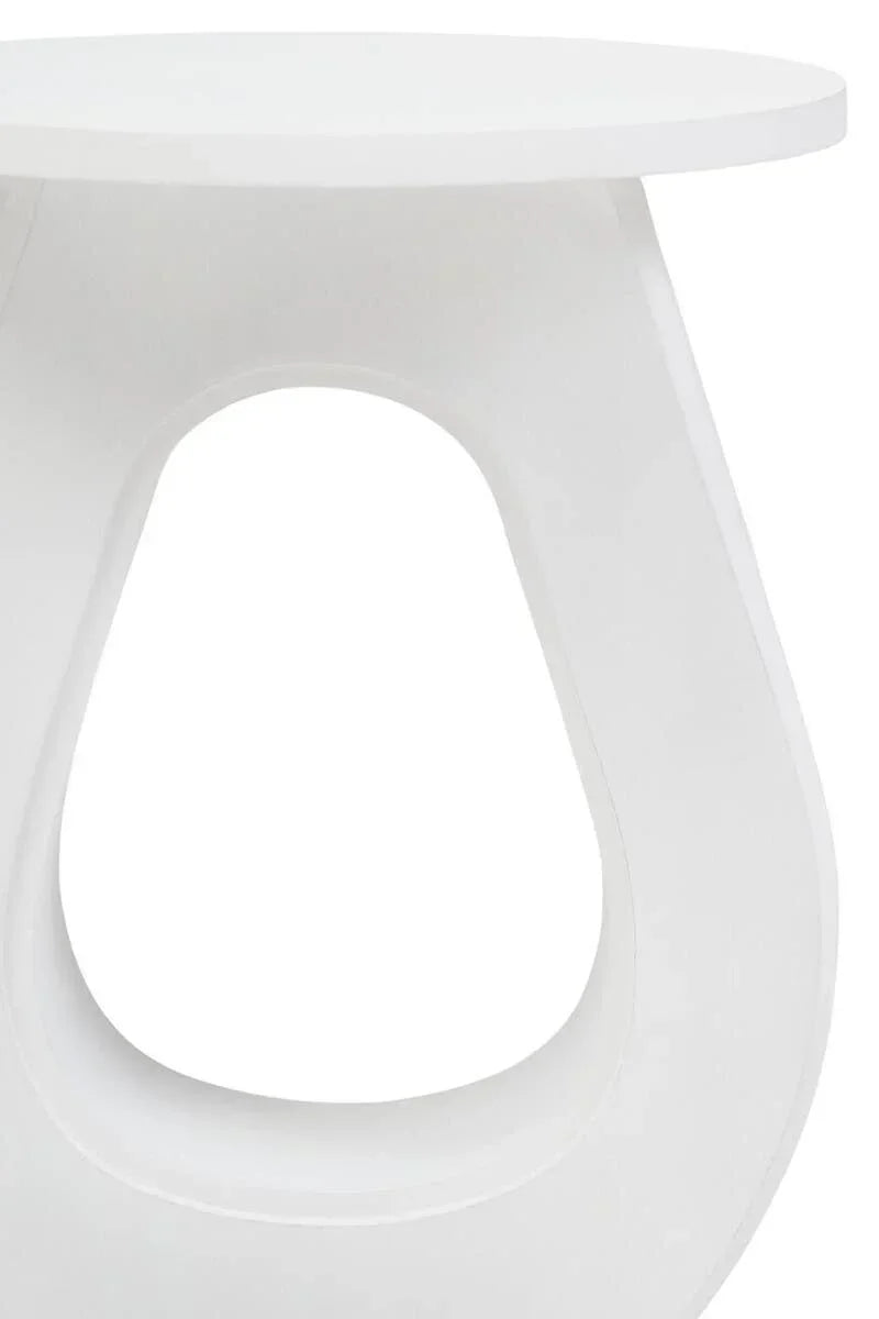 White round side table with modern sculpted base opening, close-up view