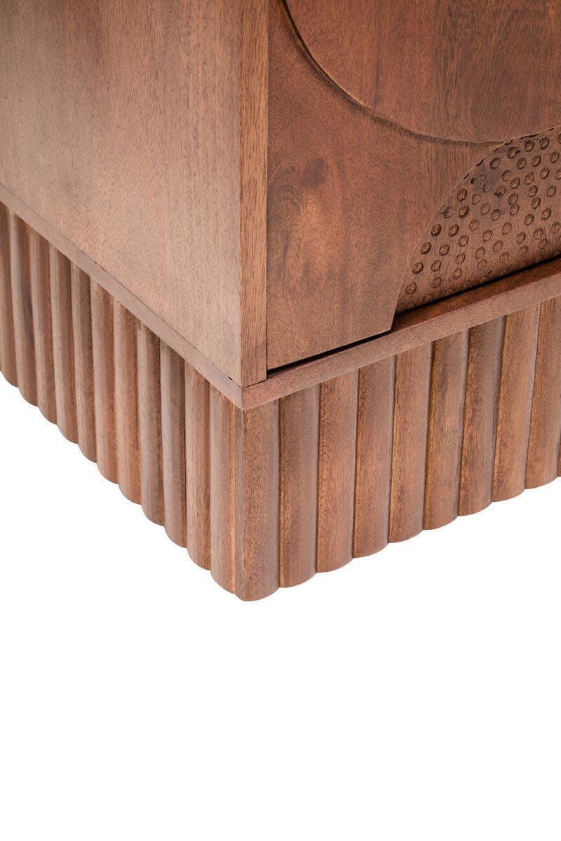Solid wood furniture corner with ribbed base and carved detailing