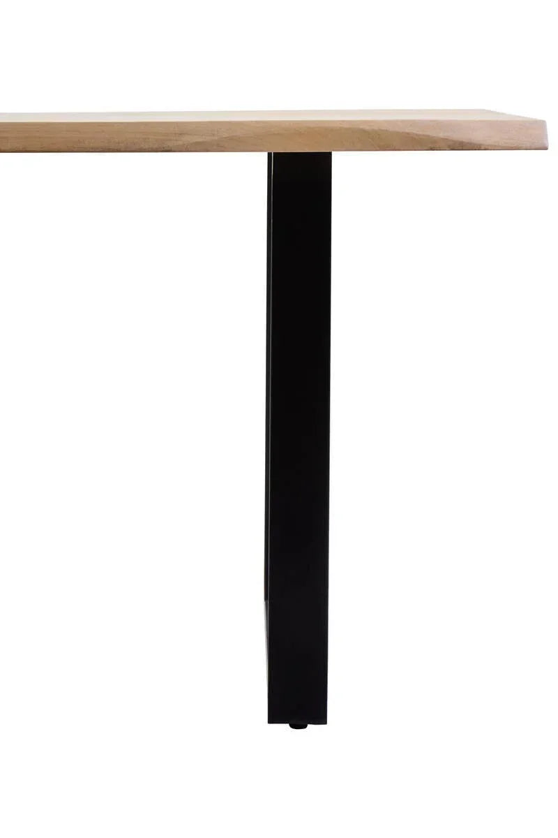 Wood dining table with black metal leg, side view close-up of tabletop and support