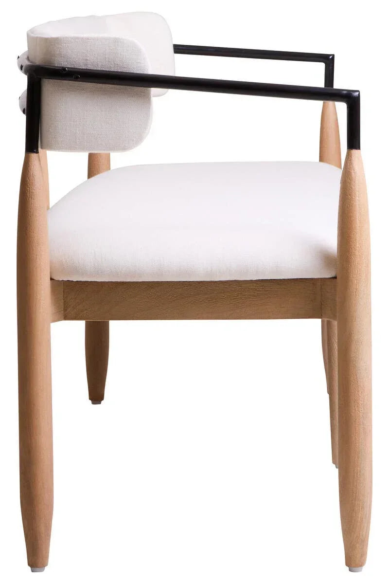 Modern accent chair with light wood legs, white cushioned seat and back, black metal arms