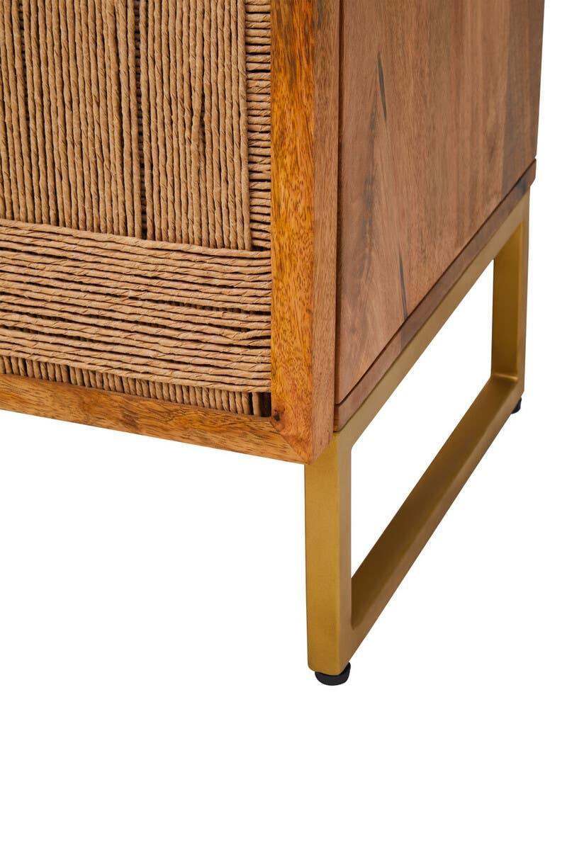 Close view of wooden sideboard with woven panel detail and gold metal leg