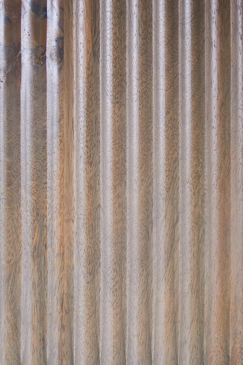 Natural wood furniture panel with vertical fluted texture and light brown finish