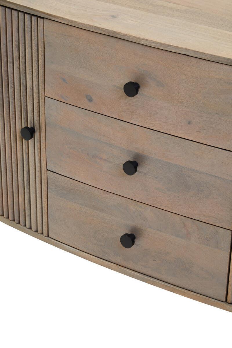 Wooden sideboard with three drawers and black handles, slatted detail on left panel