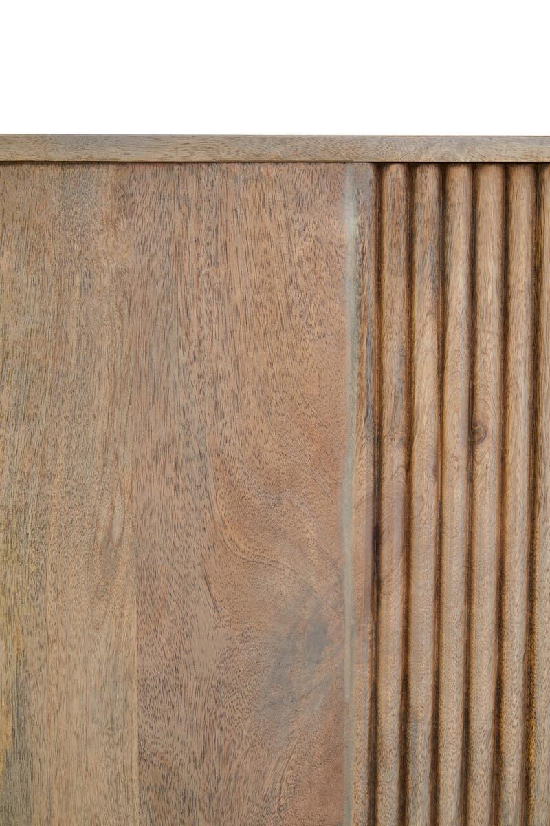 Closeup of wooden furniture panel with smooth surface and vertical fluted detailing