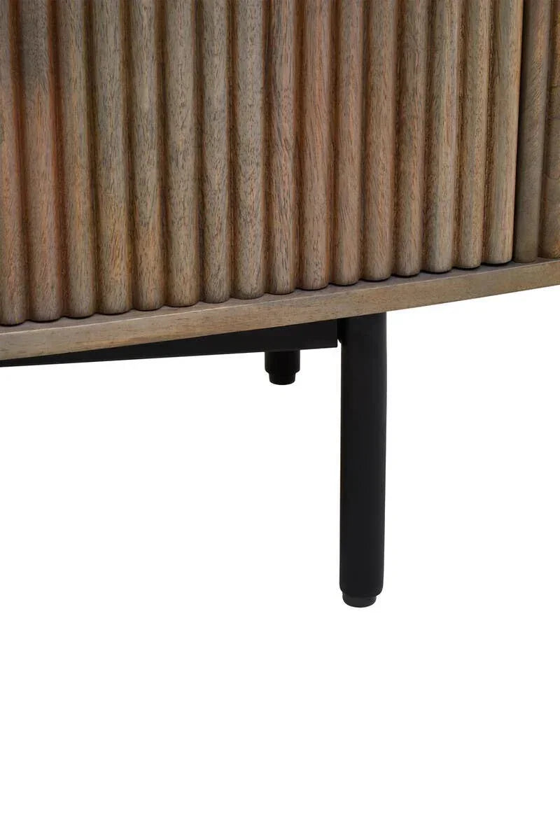 Textured wood sideboard detail with black metal leg and fluted panel design