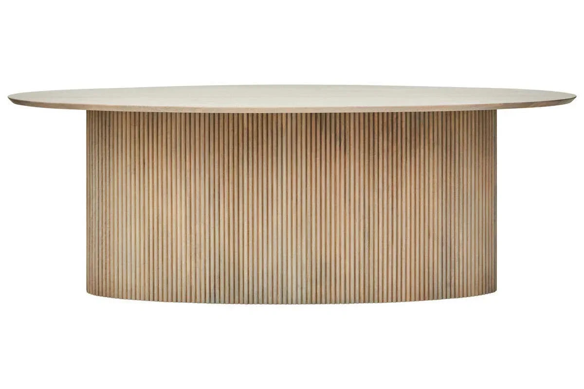 Round wooden dining table with ribbed cylindrical base and light wood finish, front view