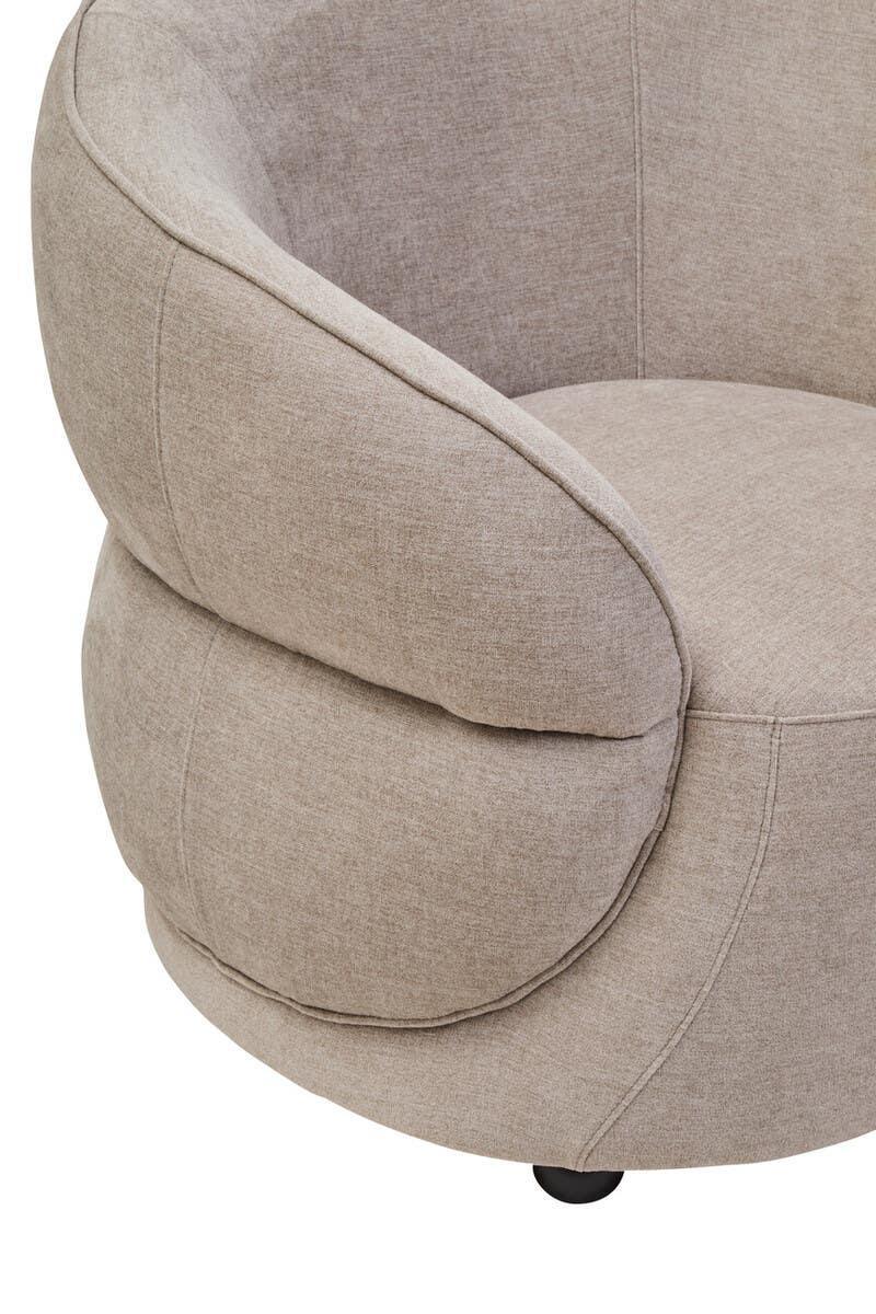 Close up of beige fabric armchair with rounded backrest and soft cushioned seat