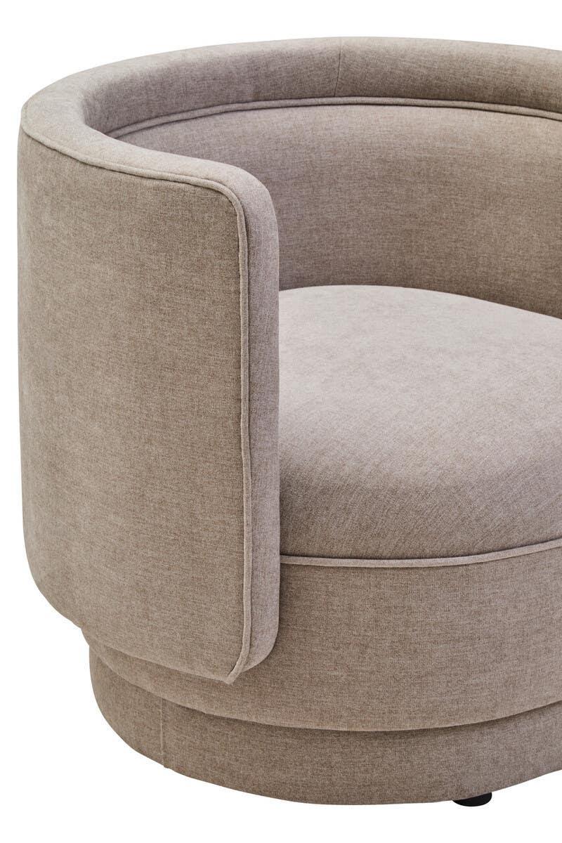 Beige fabric swivel chair with curved backrest and modern upholstery, close-up view
