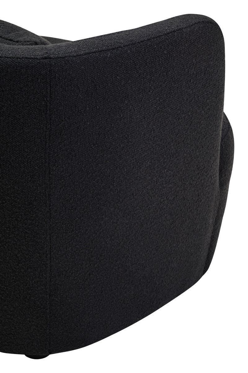 Curved backrest of a black fabric sofa chair, close-up on upholstery texture