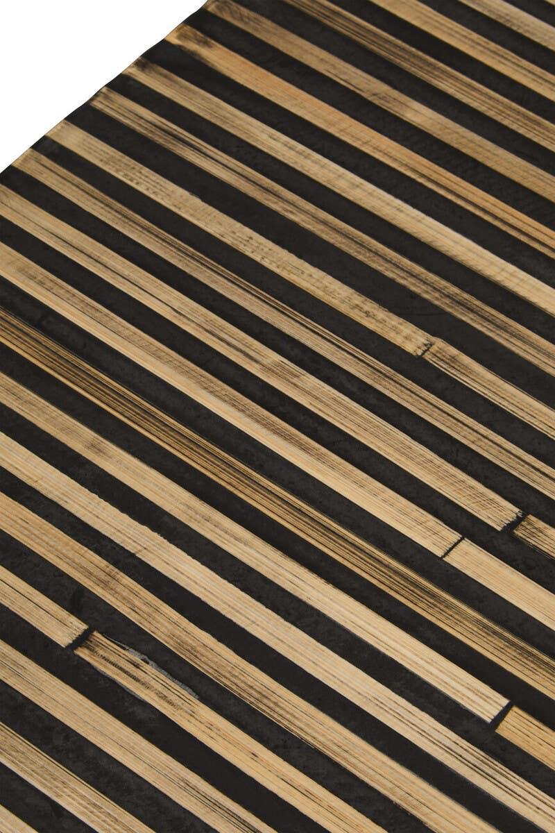Close up of striped wooden table top featuring natural and black wood grain pattern