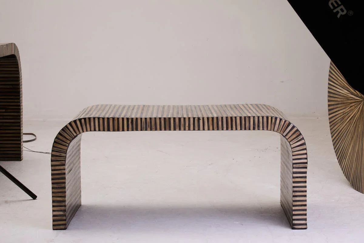 Striped wood coffee table with curved legs on white background, modern living room furniture