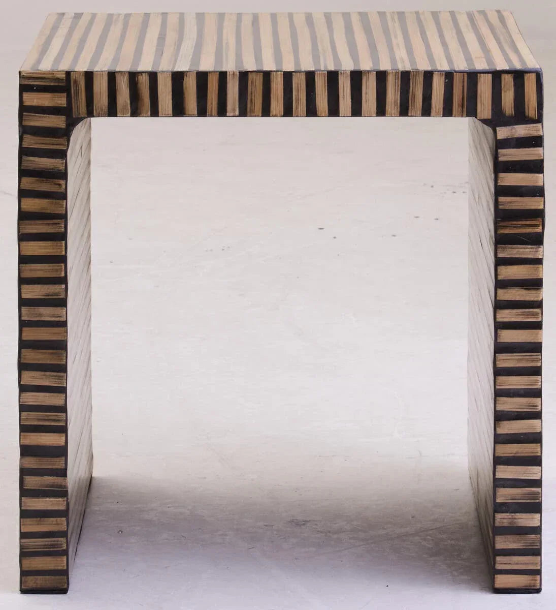 Rectangular side table with black and natural striped wood veneer design, front view