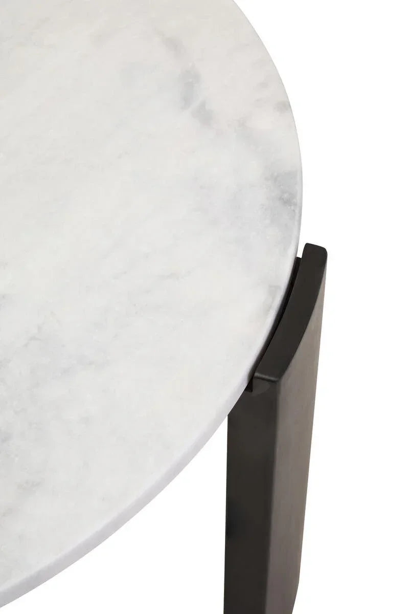 Round white marble table top with black metal leg, close-up view
