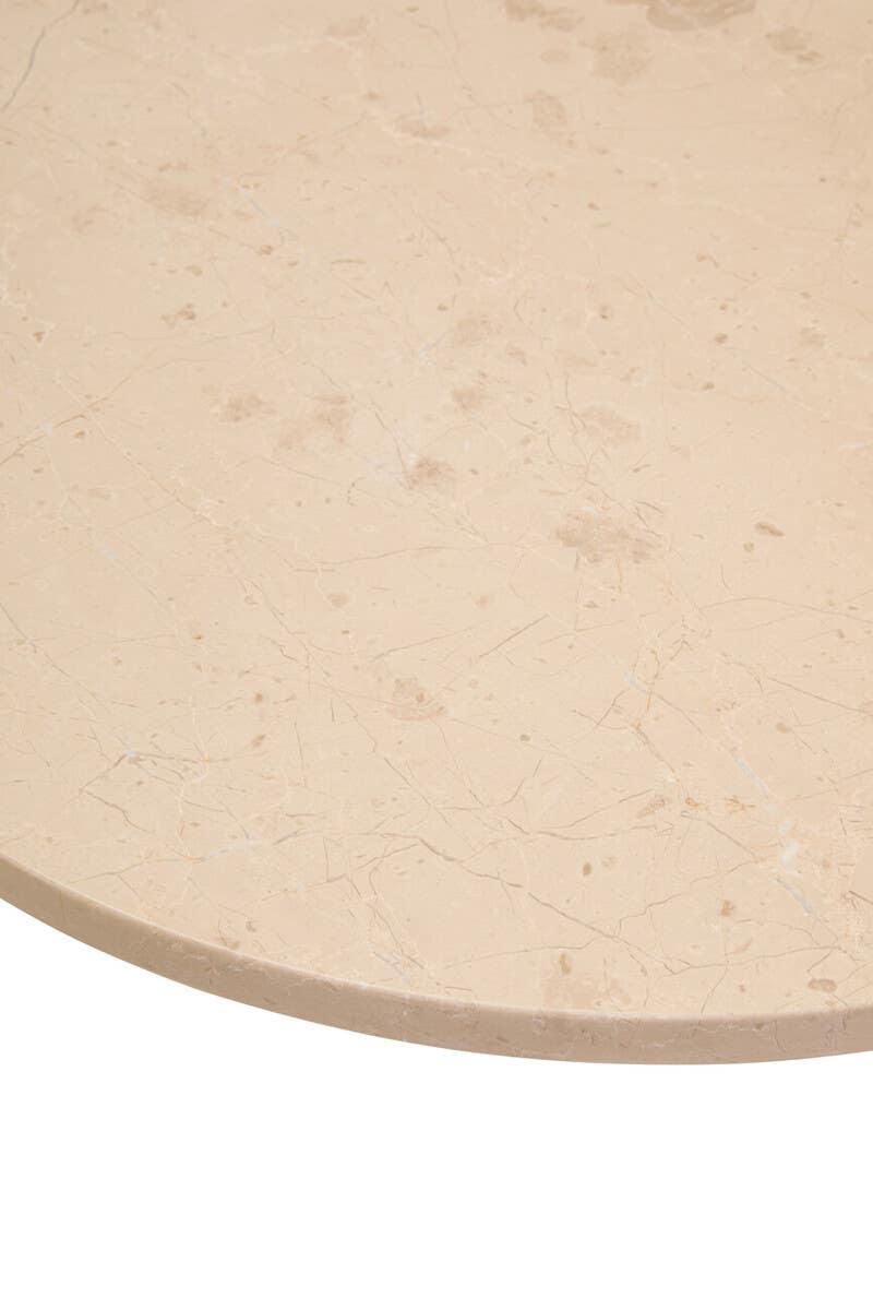 Beige marble table top with natural veining detail, close-up view of smooth stone finish