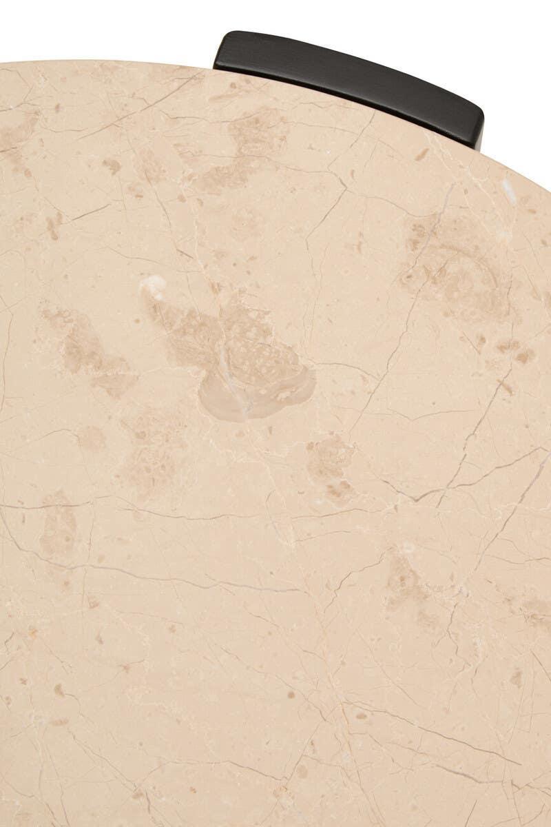 Close-up beige marble tabletop with natural veining and black metal edge