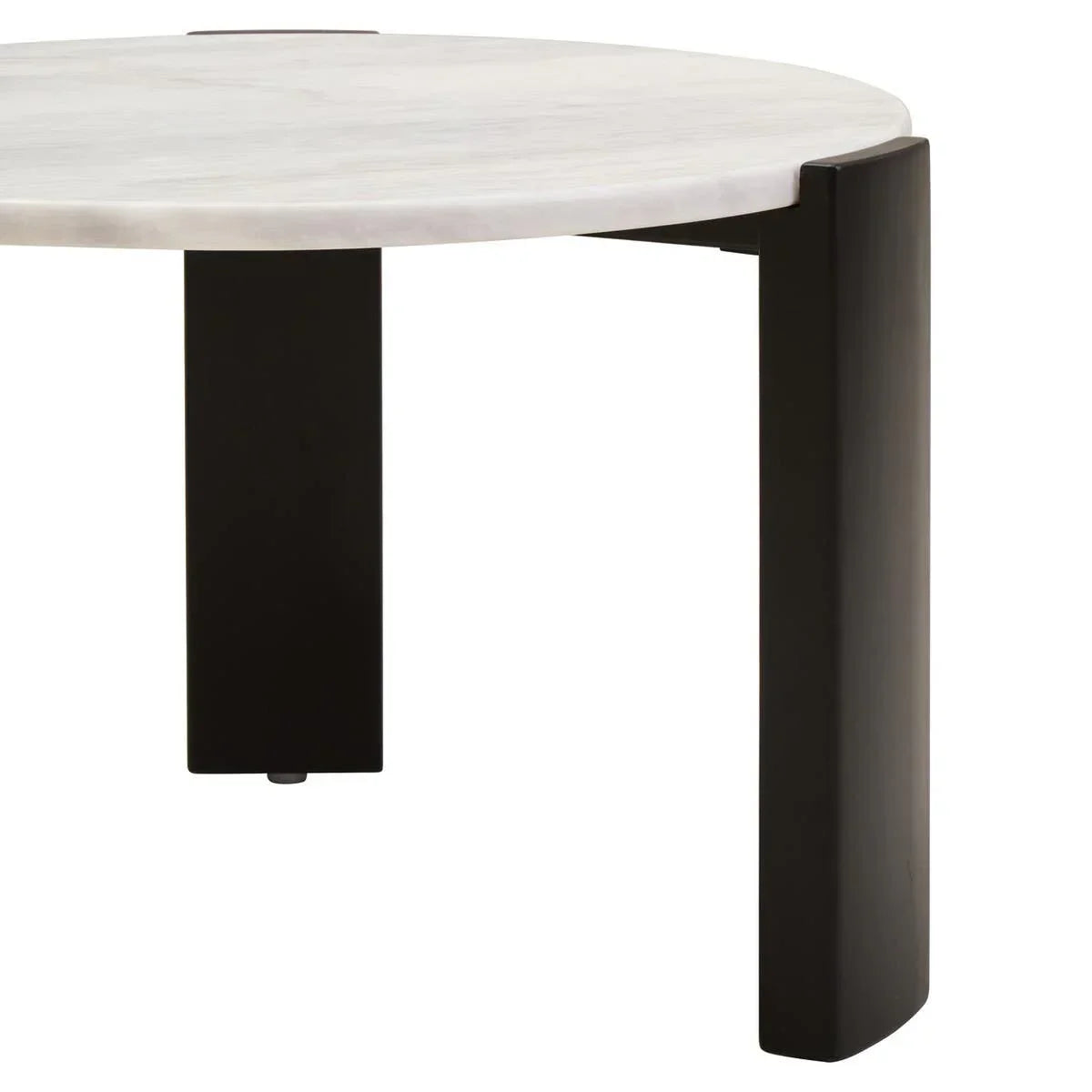 Round marble coffee table with black metal legs, close-up of tabletop and leg design