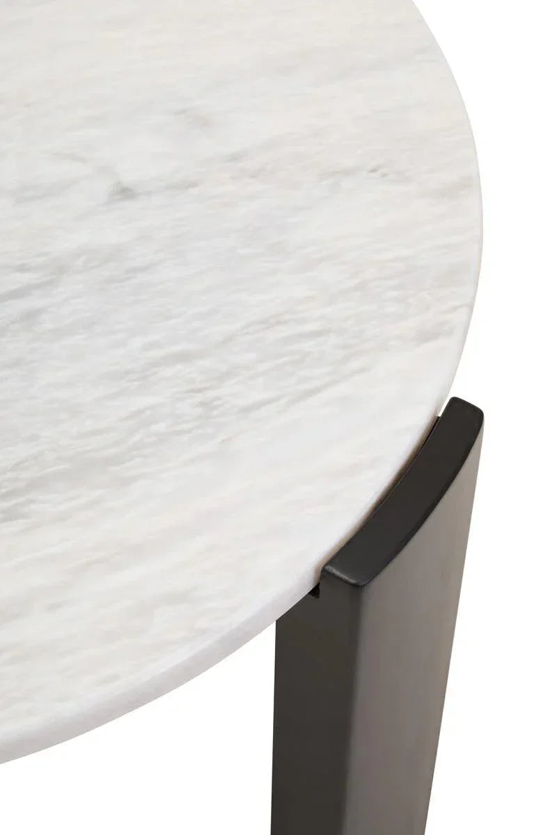 Round marble table top with black metal leg close-up