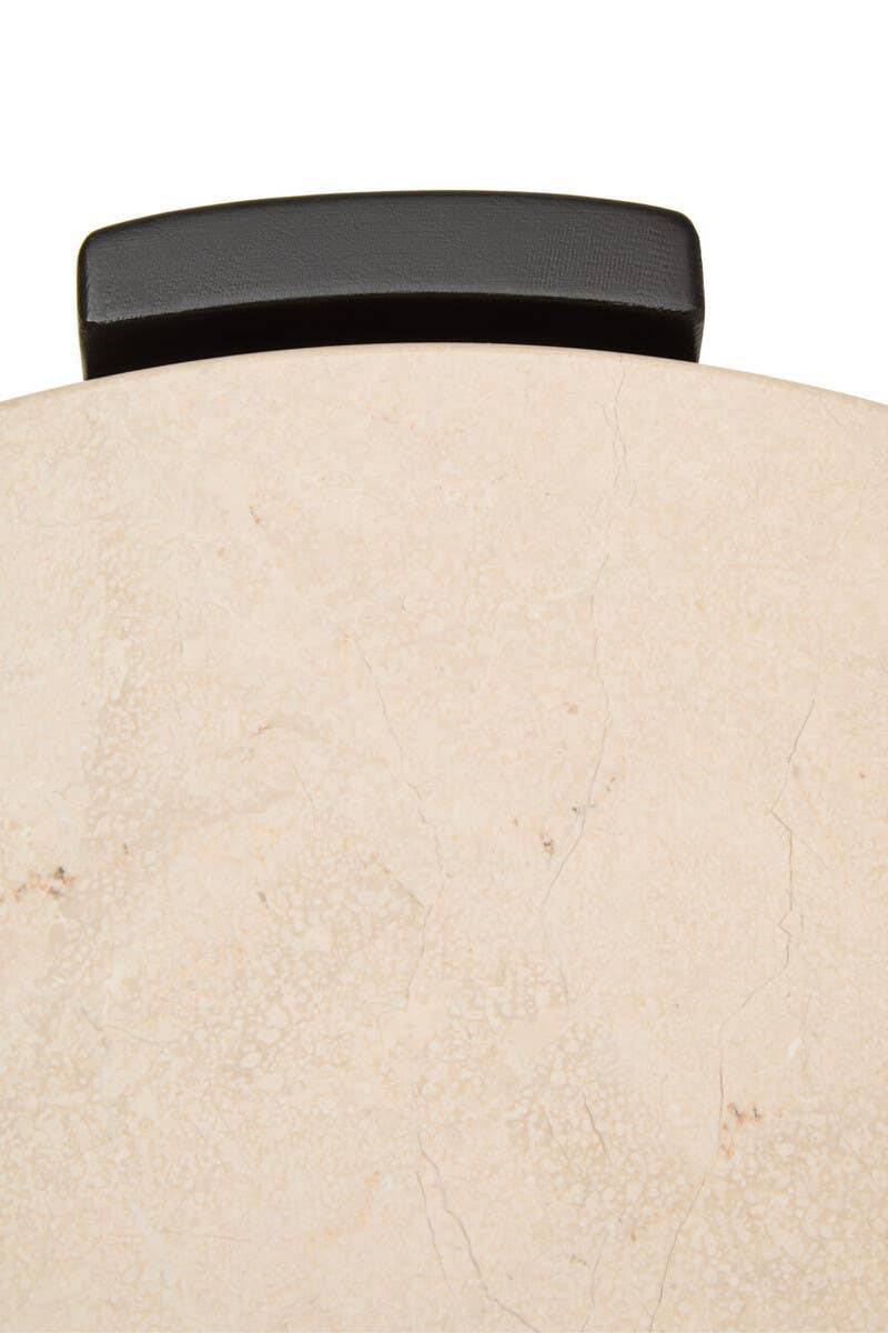 Marble side table top with black metal edge detail, close-up view