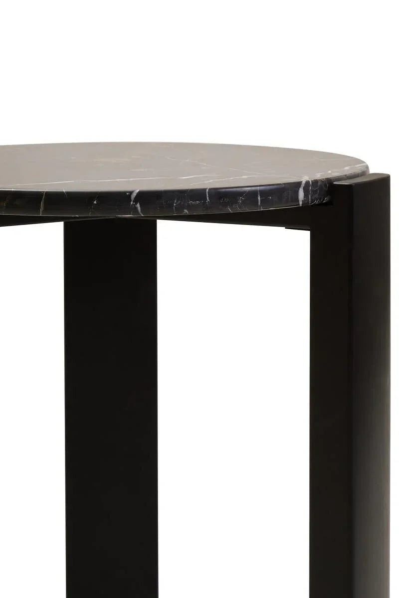 Round black marble coffee table close-up showing top and sturdy leg design