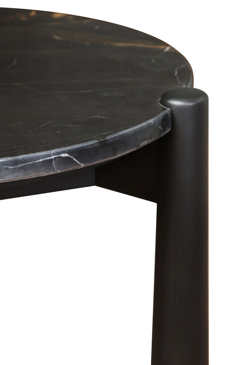 Round side table featuring a sleek black and white marble top with subtle veining, complemented by sturdy mango wood legs.