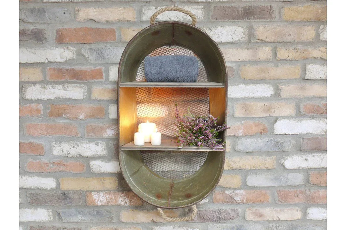 Industrial metal wall shelf with candles, towel, and flowers on exposed brick wall
