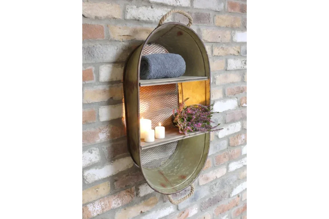 metal wall shelf with rope handle, candles, towel, and flowers on brick wall