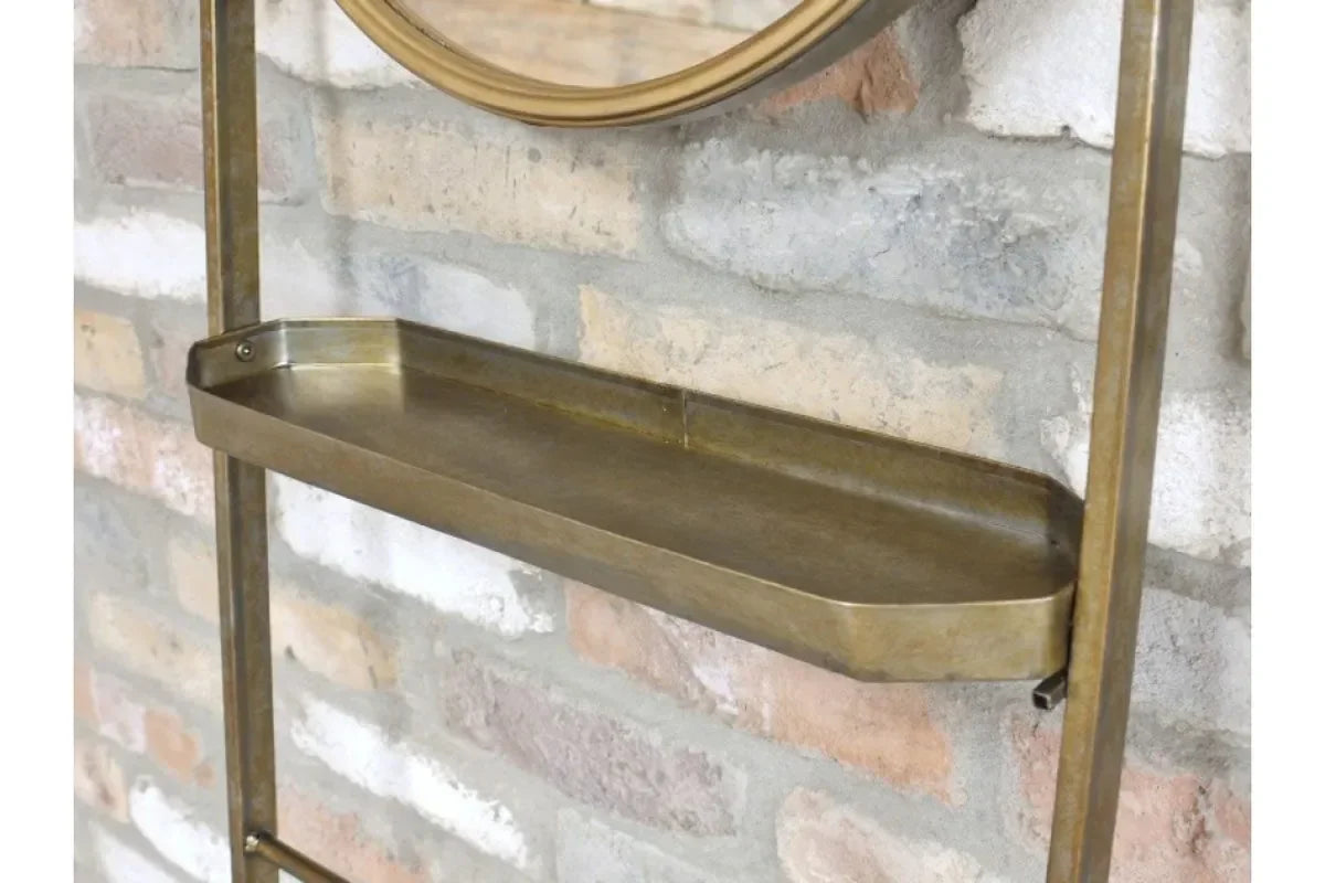 Brass metal wall shelf with raised edge mounted on exposed brick background