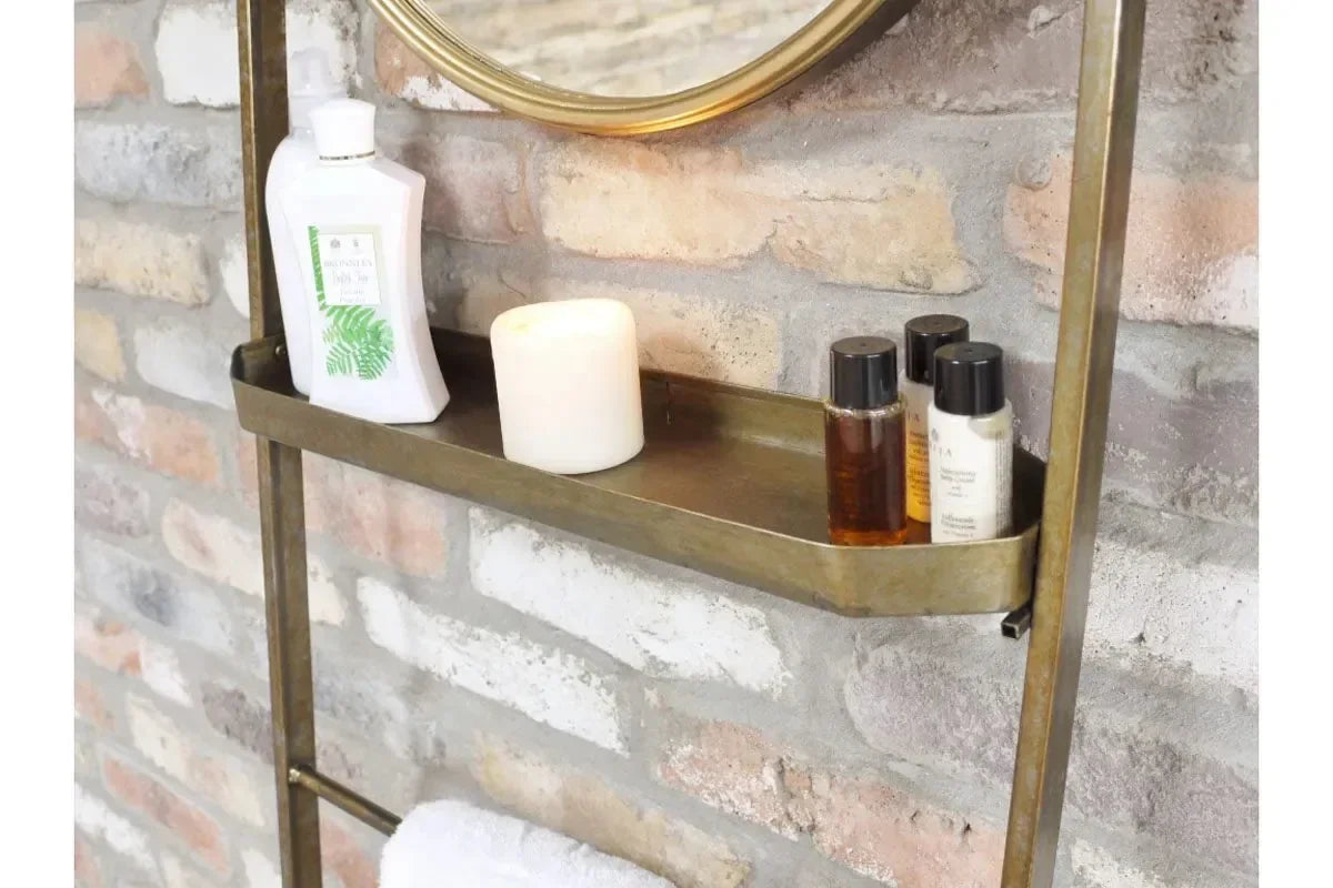 Wall-mounted metal bathroom shelf with toiletries and candle against brick wall