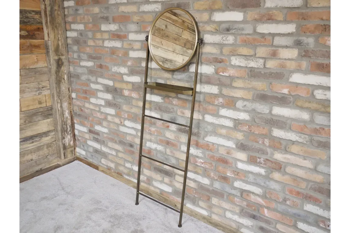 Industrial ladder mirror with wooden shelf against exposed brick wall