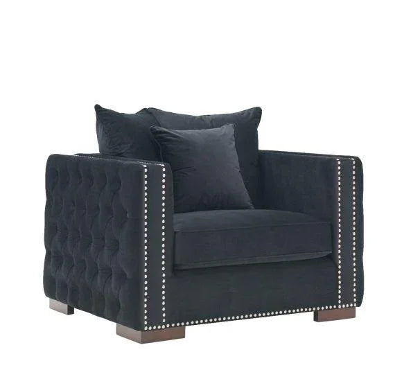 Black velvet armchair with button-tufted sides, silver stud trim and square wooden legs