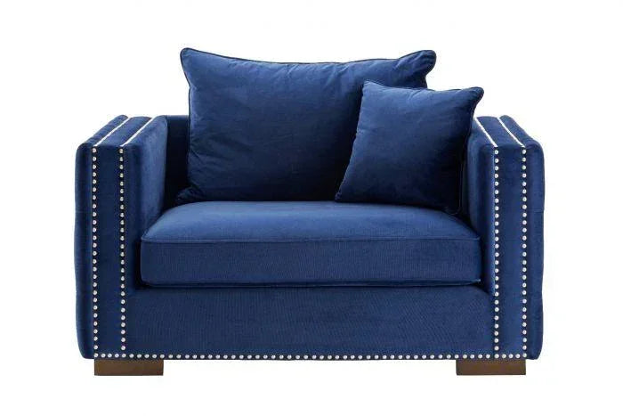 Navy blue velvet armchair with silver stud detailing and two matching cushions