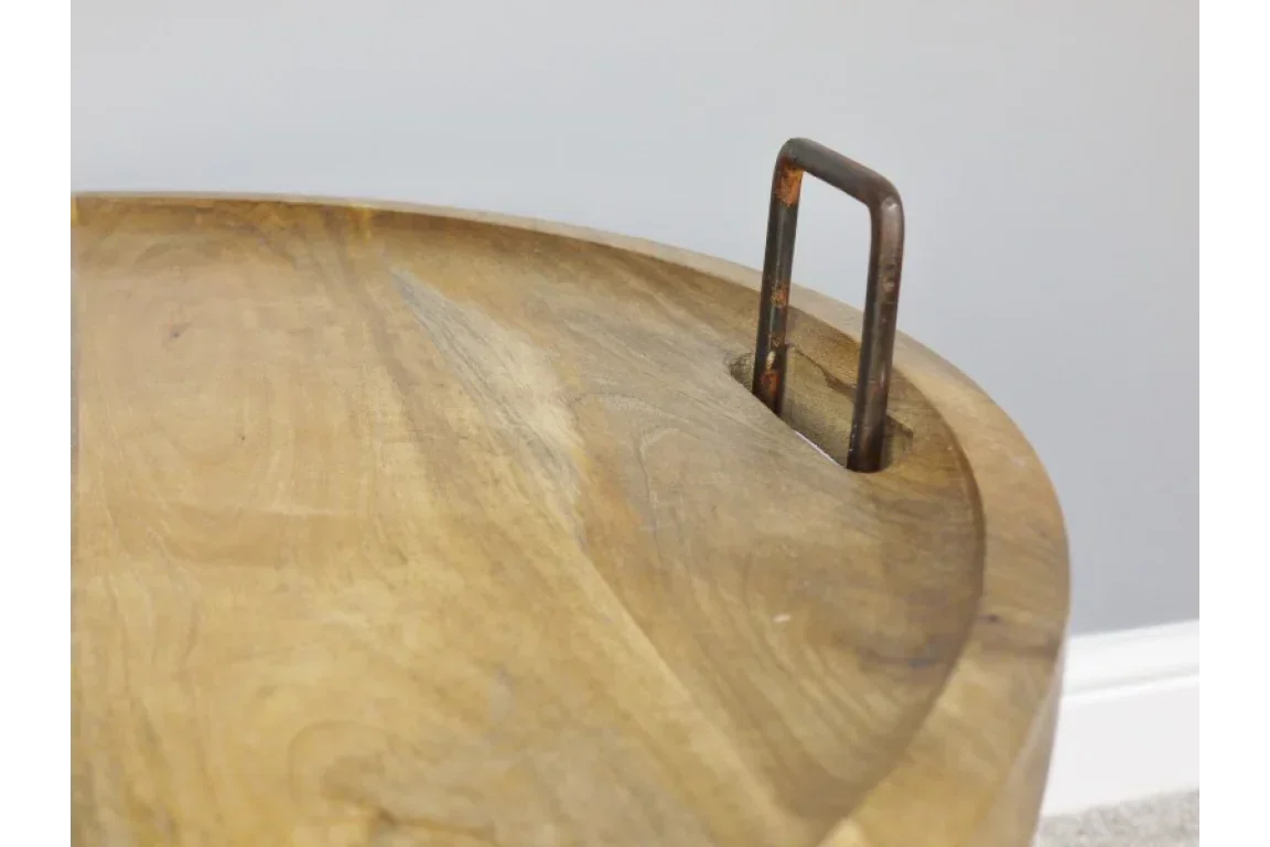 Close up of wooden table top with metal handle inset