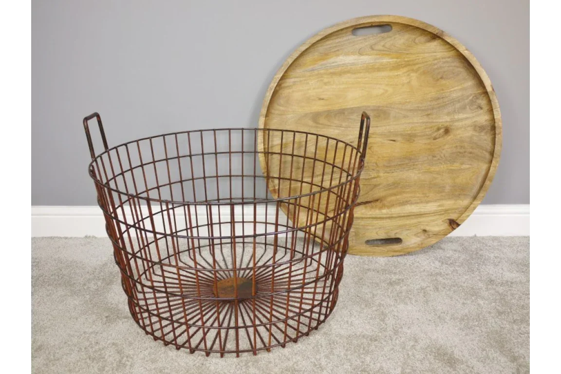 Round metal wire storage basket with wooden lid on grey carpet