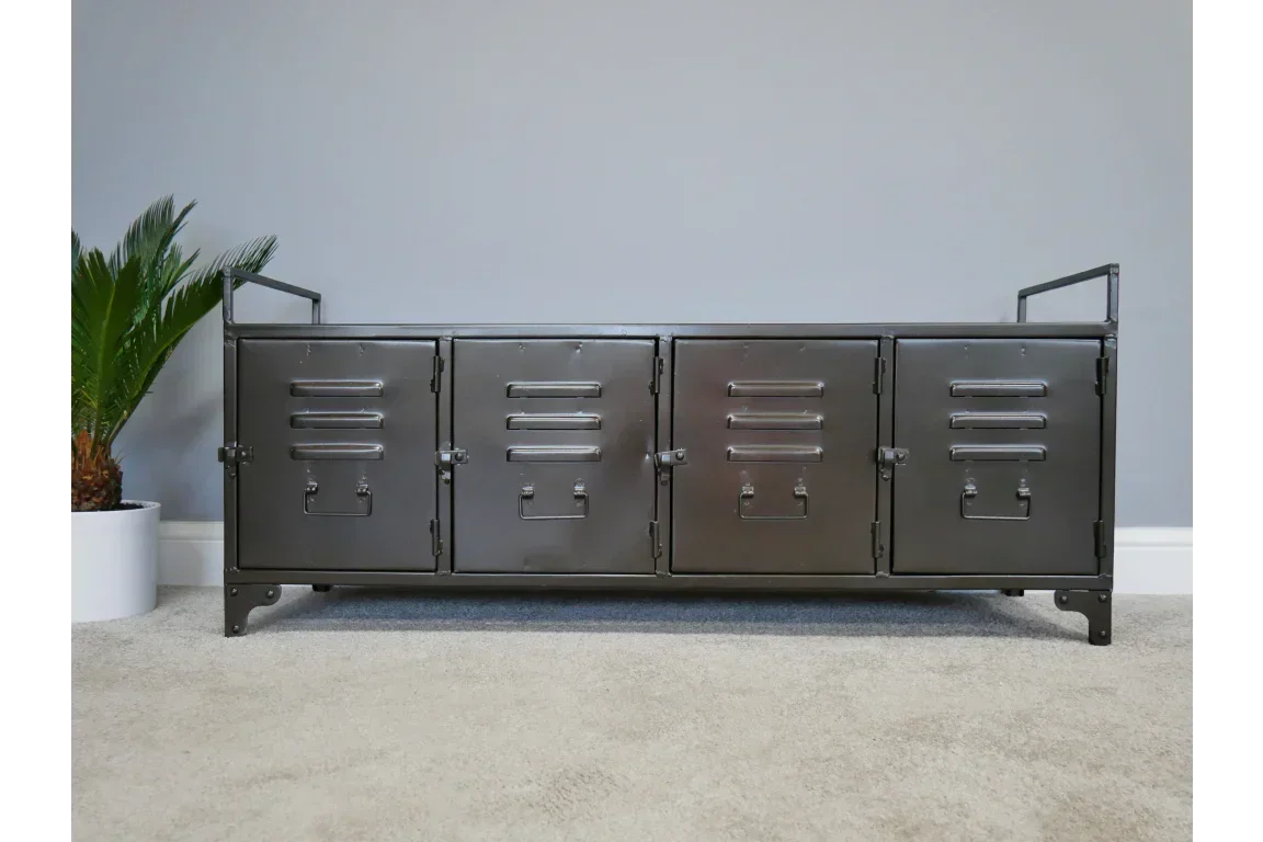 Industrial metal storage sideboard with four locker-style doors on carpeted floor
