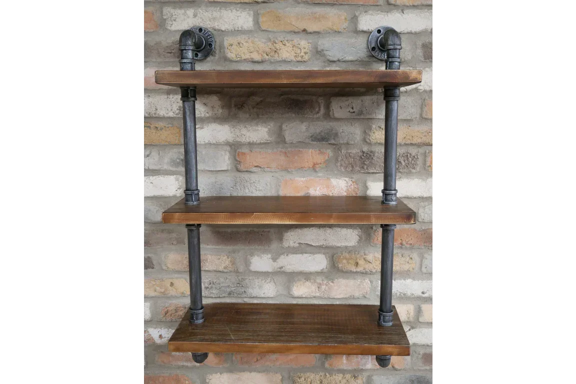 Industrial wall shelf with three wooden shelves and black metal pipe supports on brick wall