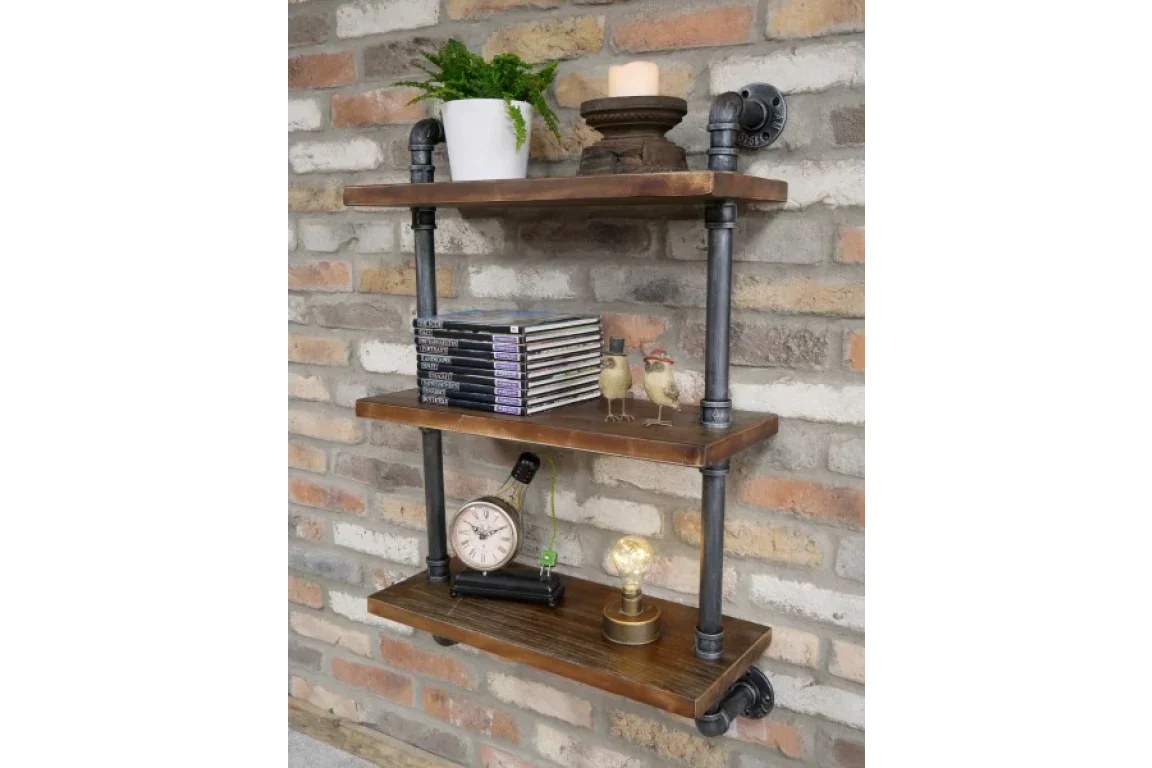 Industrial wall shelf unit with wood shelves and metal pipes, styled with decor items